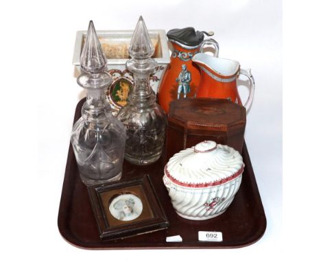 A George III inlaid mahogany tea caddy, porcelain caddy of similar date, two Wedgwood jugs, portrait miniature on porcelain, 