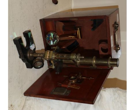 A French brass microscope together with an associated case and a kaleidoscope