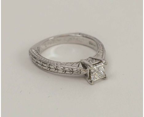 14K WHITE GOLD RING SET A CENTRAL PRINCESS CUT DIAMOND, approx 60 points, size 'K'.