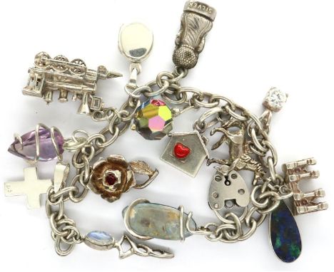 925 silver charm bracelet with fourteen charms to include a horse, L: 20 cm. P&amp;P Group 1 (£14+VAT for the first lot and £