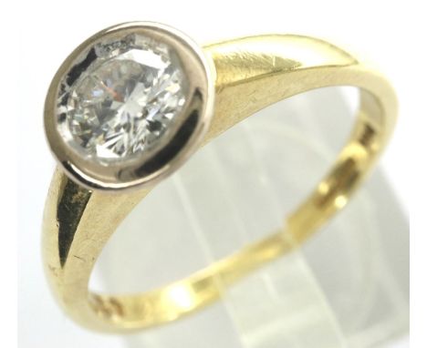 18ct gold and diamond solitaire ring, new old stock, 0.30cts, rub-over set, 3.5g, RRP £1300. P&amp;P Group 1 (£14+VAT for the