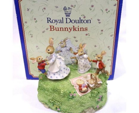 Royal Doulton Bunnykins musical figural group, Picnic Time, boxed, working at lotting, H: 13 cm. No cracks, chips or visible 