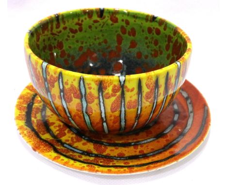 Anita Harris gold signed bowl and saucer, saucer D: 10 cm. P&amp;P Group 1 (£14+VAT for the first lot and £1+VAT for subseque