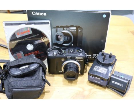 Canon Powershot G7 camera with charger, spare batteries etc, in working order. P&amp;P Group 2 (£18+VAT for the first lot and