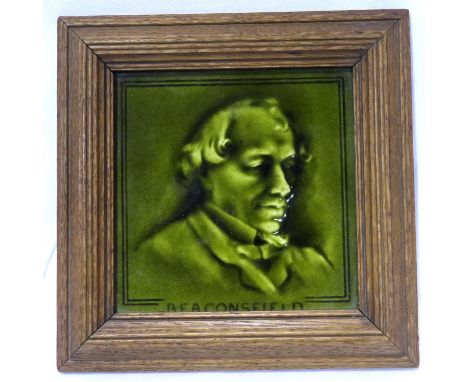 Dunnill and Co 19th century tile depicting Earl Beaconsfield, oak framed, overall 22 x 22 cm. P&amp;P Group 2 (£18+VAT for th