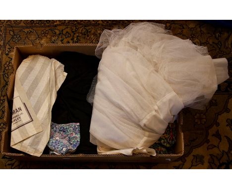 A full length tulle white 1960's underskirt; a later 1960's cotton voile dress, autumnal shades on black background, maxi len