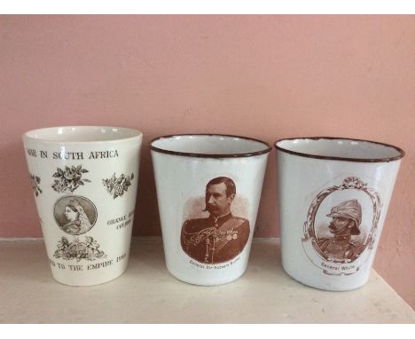 A Victorian ceramic beaker, entitled "War in South Africa beaker, Added to the Empire 1900", depicting Queen Victoria and rea