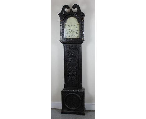 A 19th Century provincial oak longcase clock, the white dial with Roman numerals, having chip carved decoration throughout, 2