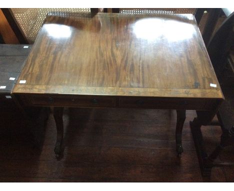 A 19th Century mahogany sofa table, with inlaid decoration, fitted with two drawers, raised on sabre legs, 74cm high, 93cm wi