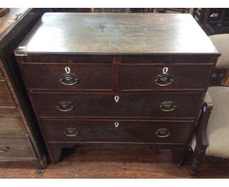 A George III oak chest of drawers, comprising two short over two long drawers, raised on bracket feet, 86cm high, 87cm wide, 