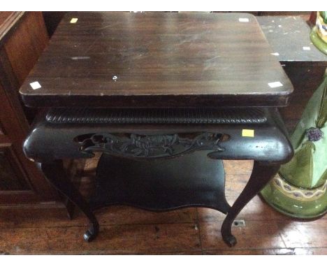 An early 20th century Chinese style hardwood pedestal table, a rectangular platform top above a carving detail edge, raised o