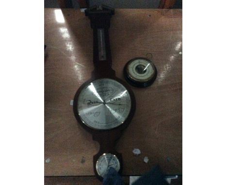 A modern barometer and thermometer and a further barometer (2)