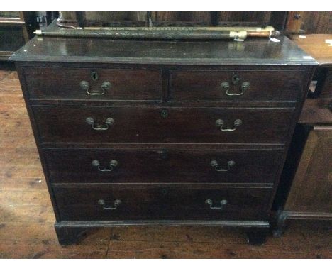 A George III oak chest of drawers, circa 1800, two short and three long drawers with brass handles on bracket feet.&nbsp;