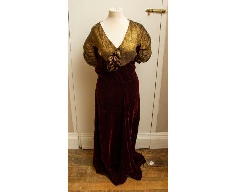 A late 1930's evening dress in deep burgundy velvet with the yoke and sleeves in woven gold metallic (some wear on both shoul