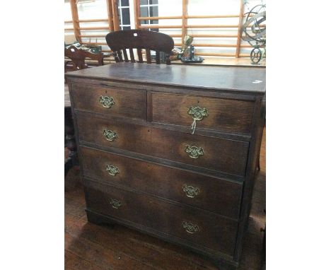 A George III oak chest of drawers, circa 1800, moulded cornice, above a two short and three long drawers on bracket feet.