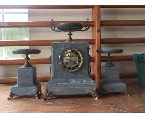 A 19th Century grey marble garniture clock set, comprising eight day mantle clock and a pair of pedestal urns, each piece sta