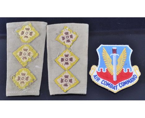 Major Eric Spencer Ridley, a collection of items to include a pair of epaulettes, an Air Combat Command cloth badge, a Britis
