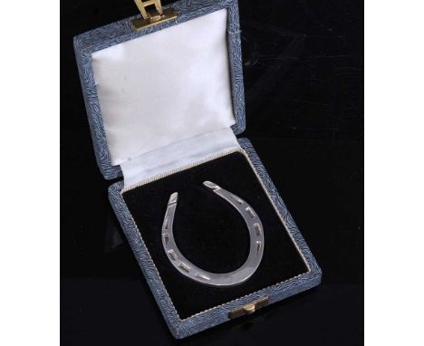 An Elizabeth II silver novelty napkin ring in the form of a horseshoe, Francis Howard Ltd, Sheffield, 1960, cased, together w