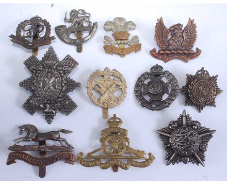 A collection of cap and glengarry badges to include Connaught Rangers, 3rd King's Own Hussars, Herefordshire Light Infantry, 