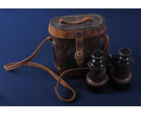 A pair of WW I French military binoculars, engraved with a broad arrow and Mk V SPL 58332, in a leather case marked Baltic Le