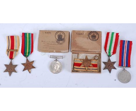 A collection of six WW II medals, to include a Defence medal in O.H.M.S. box addressed to Mrs. O.M. Garrigan, Newport, Monmon