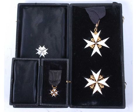 The Most Venerable Order of St John set of insignia to include neck badge the Maltese cross in gilt and white enamel with lio