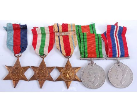 A collection of five WW II medals, to include 1939-1945 Star, Italy Star, Africa Star with 1st Army clasp, Defence and War. (