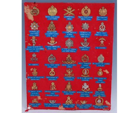A collection of cap badges and insignia to include The Royal Engineers, Machine Gun Corps, 18th (Princess of Wales's Own) Hus