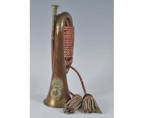 A copper and brass bugle with applied badge for the 23rd Royal Welsh Fusiliers, 31cm.
