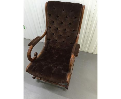 Brown button back rocking chair