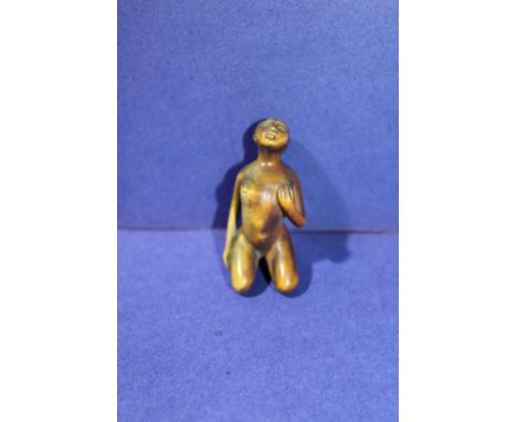 A carved wooden erotic themed netsuke 