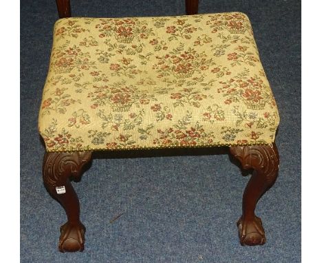 A Chippendale style mahogany dressing stool, with floral upholstered top raised on cabriole supports with ball and claw foot,
