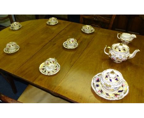 A late Victorian teaset, comprising teapot, milk jug and sucrier, six cups, five saucers, one side plate and one cake plate, 