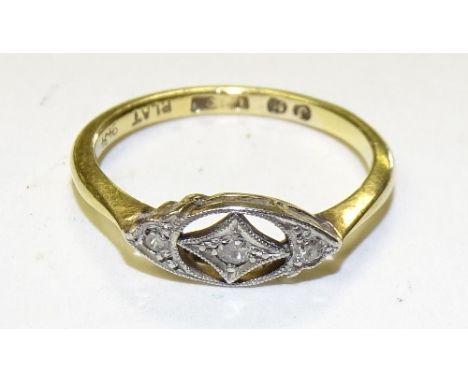 An 18ct gold diamond ring, set with three small brilliant cut diamonds, stamped 18, ring size M, 2.3g   CONDITION REPORT:  Lo