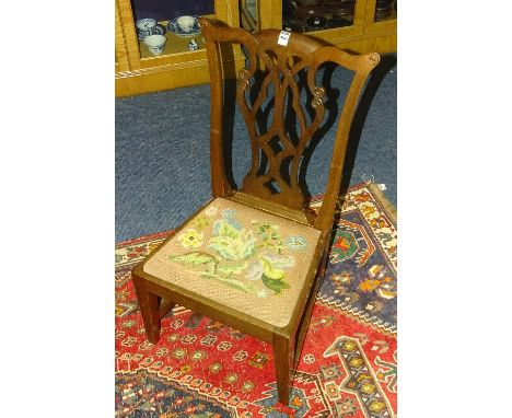 A Chippendale style mahogany nursing chair, with pierced splat above floral embroidered seat, 78cm high