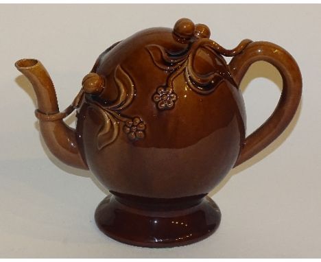A Victorian Spode brown glazed teapot designed by R Hiles, decorated in relief with flowers and fruit, with impressed marks t