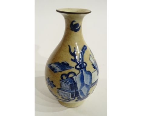 A Chinese blue and white crackle glaze vase circa late 19th century, of baluster form, decorated with a panel of vases and ob