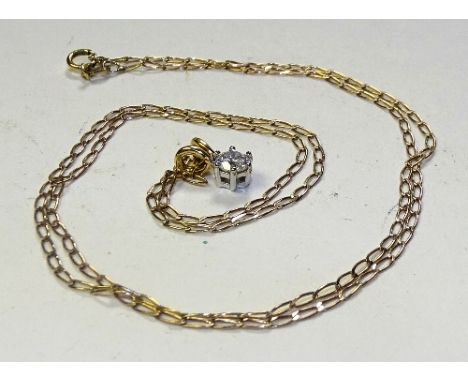 An 18ct gold diamond solitaire pendant on 9ct gold chain, the brilliant cut diamond approx 0.25ct in total, set in 18ct white