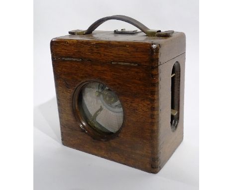 A pigeon timing clock by H.Martens and Co, in oak carry case with leather handle, 20cm high x 20cm wide x 12cm deep