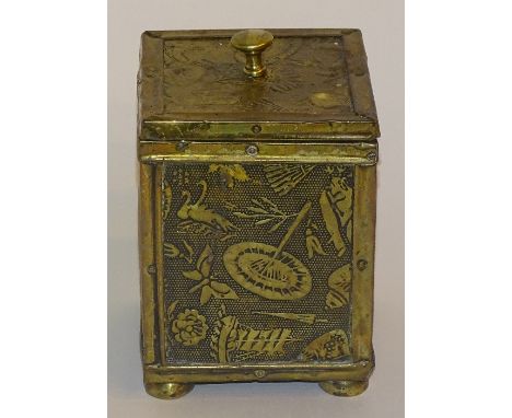 An early 20th century Japanese brass tea caddy, of rectangular form with lead lined interior and moulded brass panels to exte