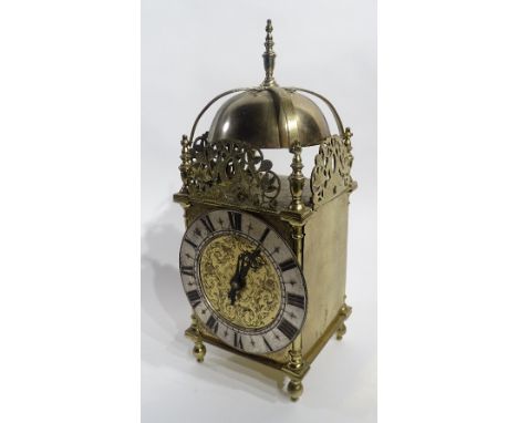 An antique brass lantern clock, with later movement, the finial to top above count wheel bell and pierced foliate fretwork, t