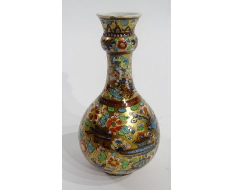 A Chinese bottle shaped vase circa late 18th century, decorated with colourful panels of masks and objects in foliage on gild