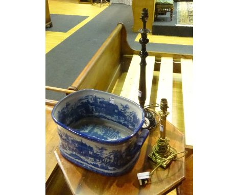 A reproduction blue and white pottery foot bath, with handles to either side, 20cm high x 50cm wide, together with a brass Co