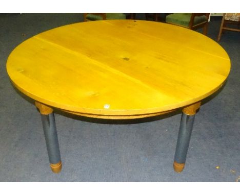 A large contemporary oak circular dining table made by the Chippendale School of Furniture, Gifford, Haddington, raised on fo