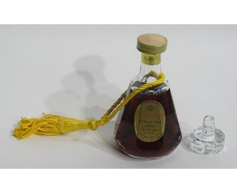 A bottle of Courvoisier cognac in Bacarat crystal decanter with stopper, in green velvet lined fitted box