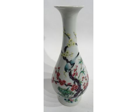 An antique Chinese famille verte vase, decorated with colourful panels of birds on branches with prunus blossoms, 30cm high  