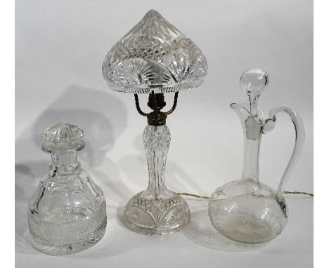 A vintage heavy cut crystal table lamp, with mushroom shade, 39cm high, together with an etched crystal claret jug with stopp