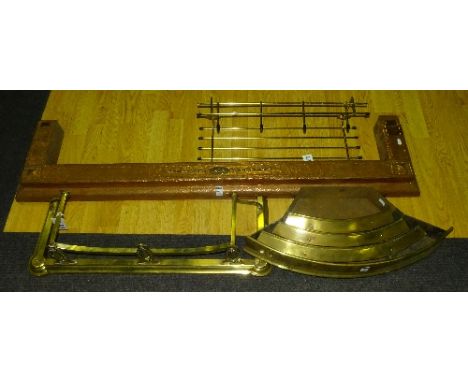 A copper fire fender, 9cm high x 143cm wide, together with two Arts & Crafts brass fire curbs and a fire grill (4)