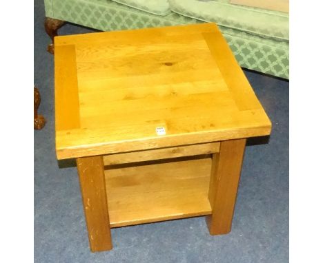 A contemporary heavy oak lamp table, of square form with undertier, 56cm high x 60cm wide