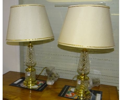 A pair of Edinburgh Crystal and gilt metal double gourd style table lamps with shades, fitted for electricity, lamp 38cm high